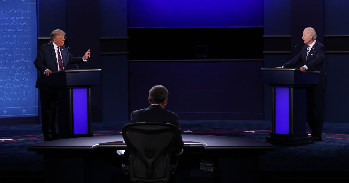 CLEVELAND, OHIO - SEPTEMBER 29: U.S. President Donald Trump and Democratic presidential nominee Joe Biden participate in the first presidential debate moderated by Fox News anchor Chris Wallace (C) at the Health Education Campus of Case Western Reserve University on September 29, 2020 in Cleveland, Ohio. This is the first of three planned debates between the two candidates in the lead up to the election on November 3.