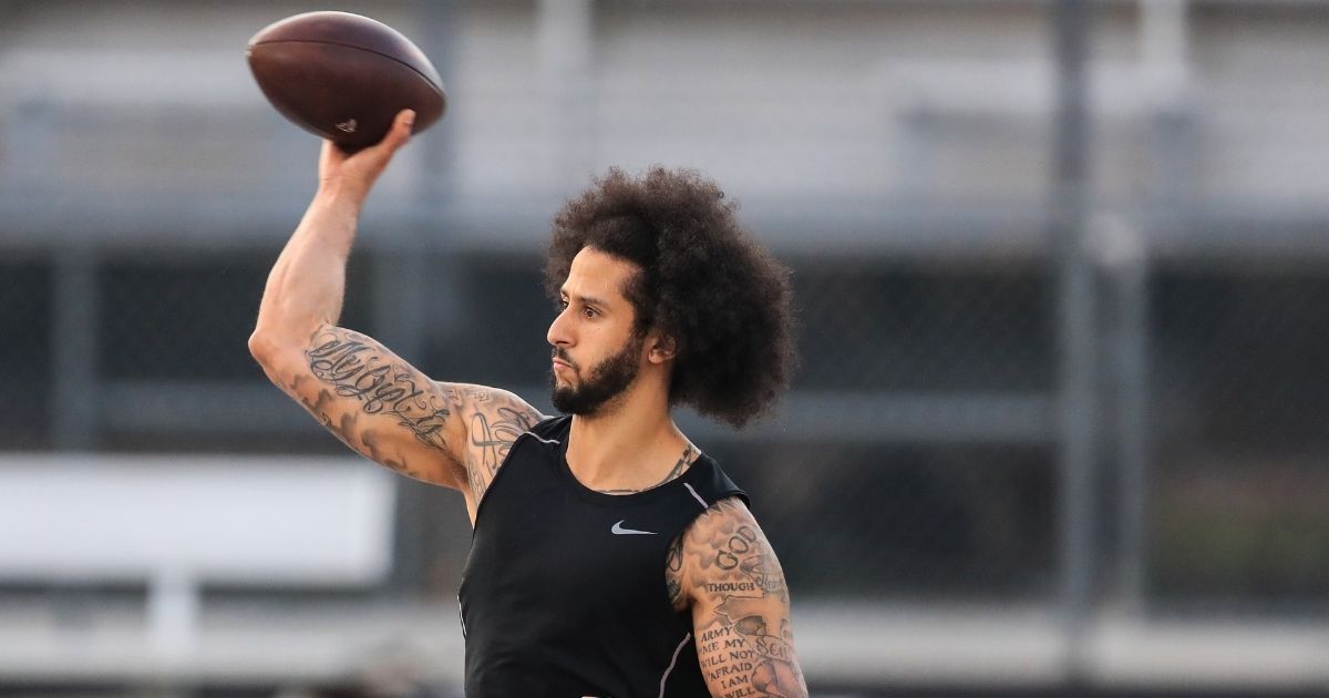 RIVERDALE, GA - NOVEMBER 16: Colin Kaepernick makes a pass during a private NFL workout held at Charles R Drew high school on November 16, 2019 in Riverdale, Georgia. Due to disagreements between Kaepernick and the NFL the location of the workout was abruptly changed.