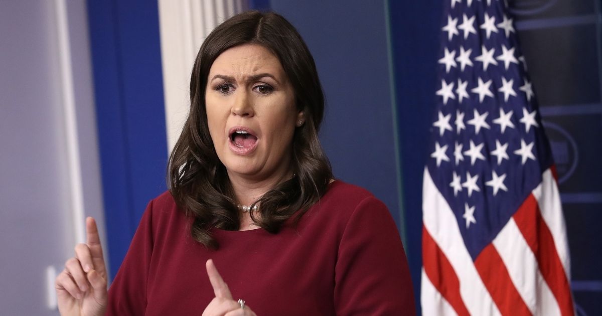 WASHINGTON, DC - DECEMBER 11: White House press secretary Sarah Huckabee Sanders answers a question during the daily briefing at the White House December 11, 2017 in Washington, DC. Sanders answered a range of questions during the briefing and repeated charges that some news organizations deliberately broadcast or print false stories about U.S. President Donald Trump.