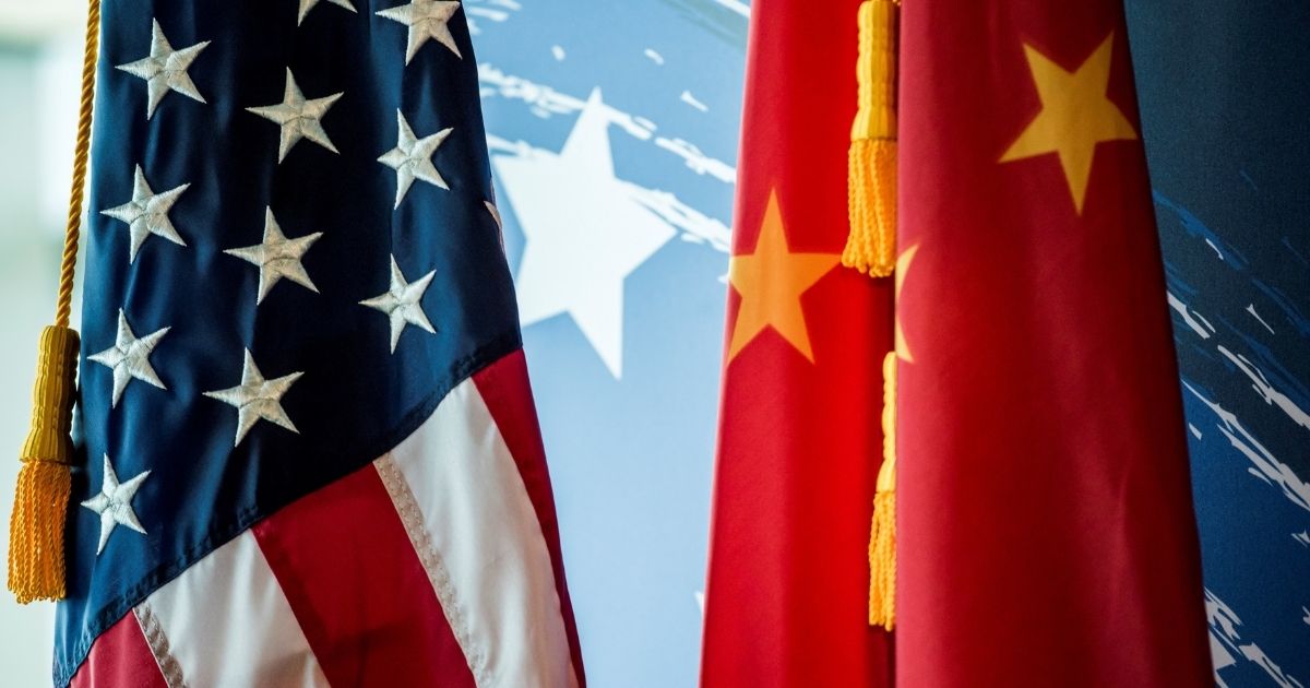 The Chinese and US national flags are seen during a promotional event in Beijing on June 30, 2017.