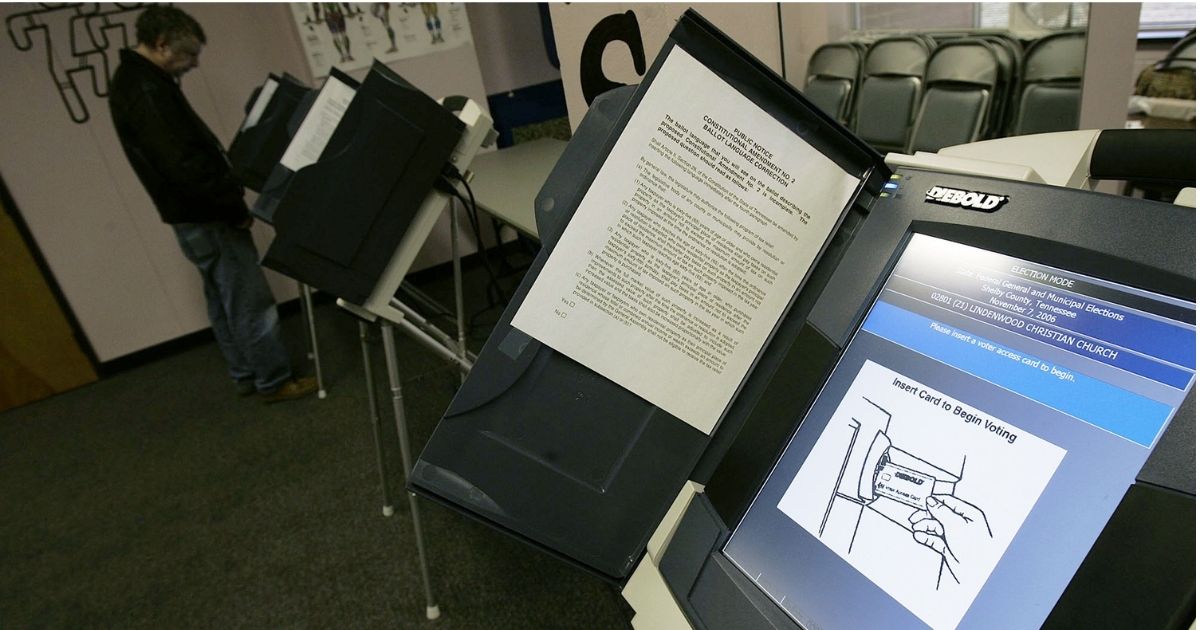 MEMPHIS, TN - NOVEMBER 07: A Diebold computerized voting machine displays instructions whole a man votes at a polling place on the morning of Election Day November 7, 2006 in Memphis, Tennessee. Elections across the nation November 7, are set to determine the balance of power in the U.S. congress with the possibility of a Democratic takeovers in the House and the Senate.