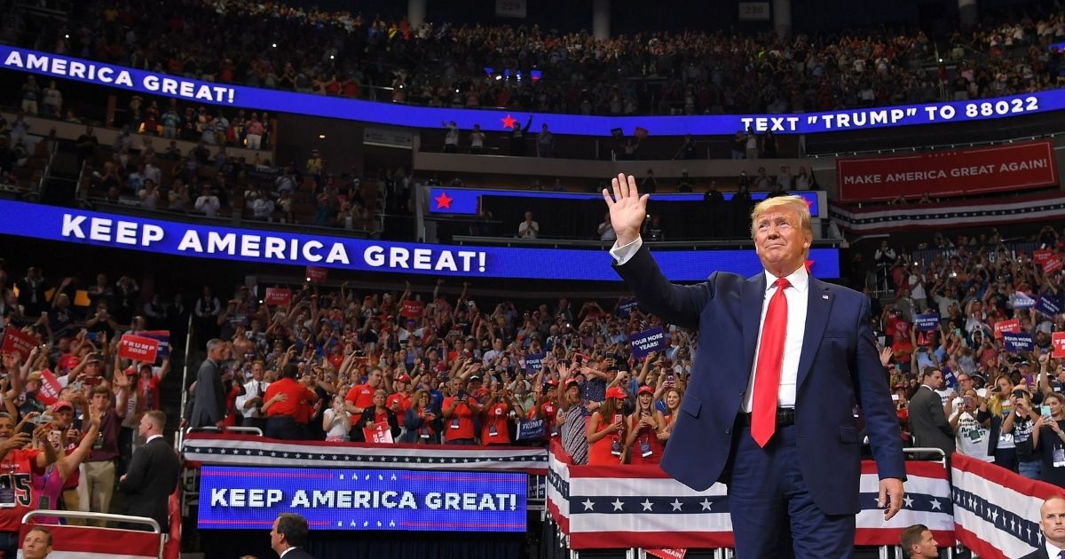 TOPSHOT - US President Donald Trump arrives to speak during a rally at the Amway Center in Orlando, Florida to officially launch his 2020 campaign on June 18, 2019. - Trump kicks off his reelection campaign at what promised to be a rollicking evening rally in Orlando.