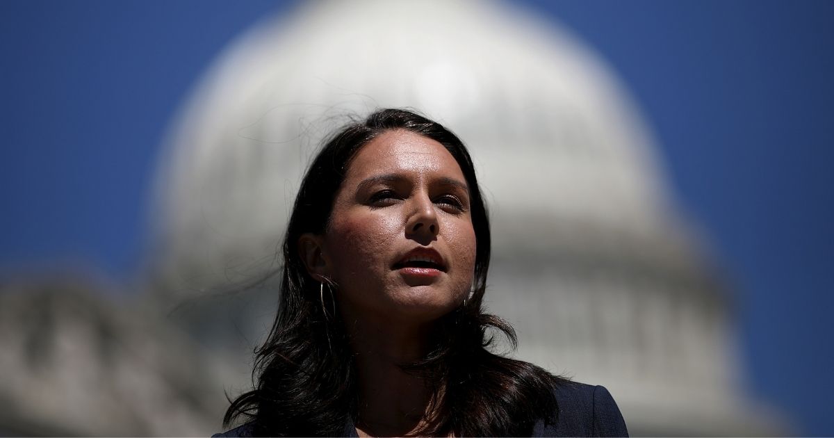 WASHINGTON, DC - JULY 18: Rep. Tulsi Gabbard (D-HI) speaks at a press conference on House Resolution 922 outside the U.S. Capitol July 18, 2018 in Washington, DC. Gabbard and Rep. Walter Jones (R-NC) spoke on reclaiming "Congress's constitutional right to declare war" and efforts to define presidential wars not declared by Congress as impeachable "high crimes and misdemeanors."