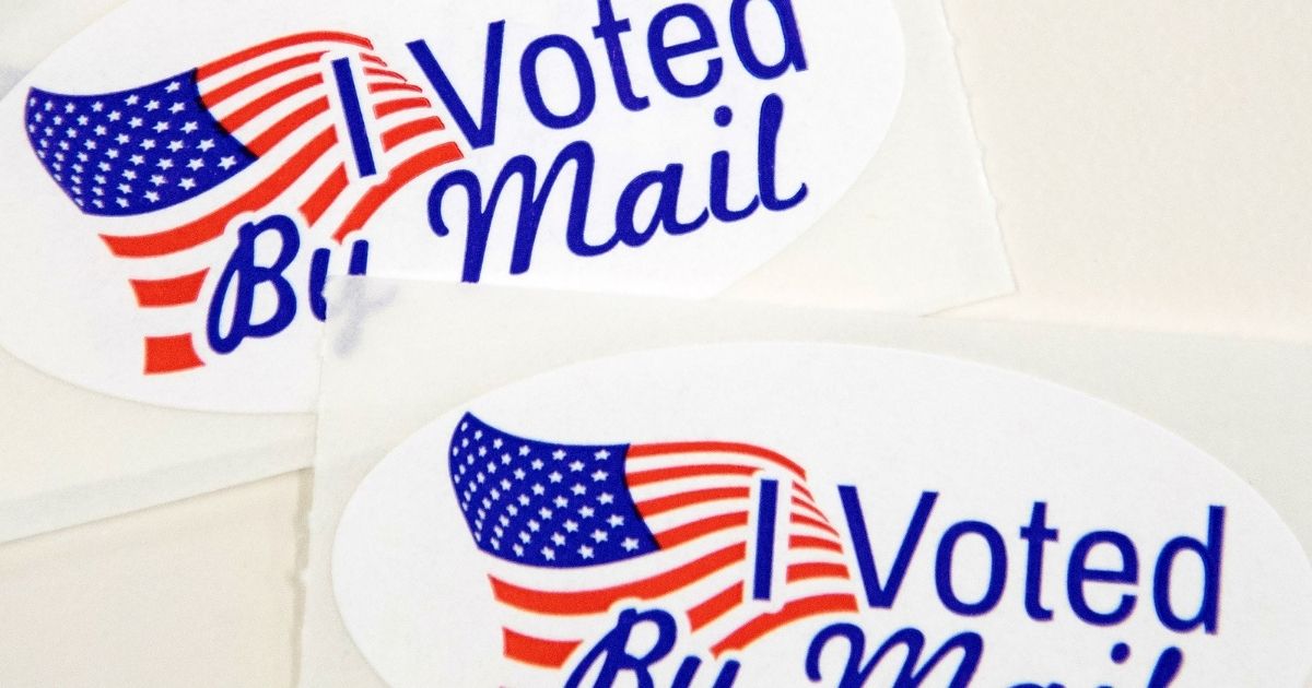 "I Voted By Mail" stickers that ballot workers in Charlotte, North Carolina put in envelopes on Friday.