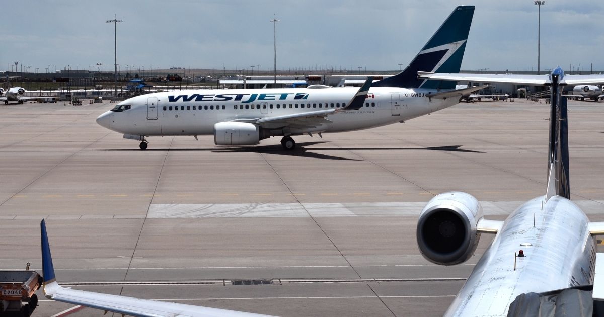 WestJet says it canceled a flight from Calgary to Toronto because a three-year-old did not wear a mask, but the father of the child says otherwise. A WestJet plans is seen in the stock image above.