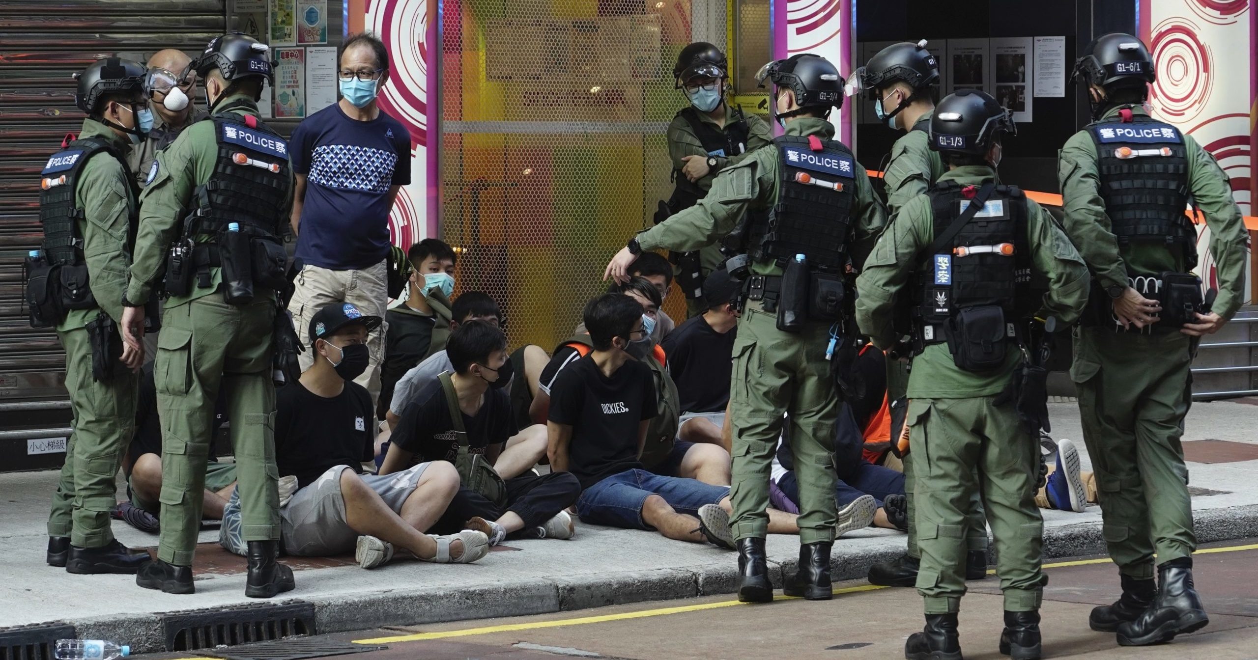 People are arrested by police officers in Hong Kong on Sep. 6, 2020. About 300 people were arrested at protests against the government's decision to postpone elections for Hong Kong's legislature, police and a news report said.