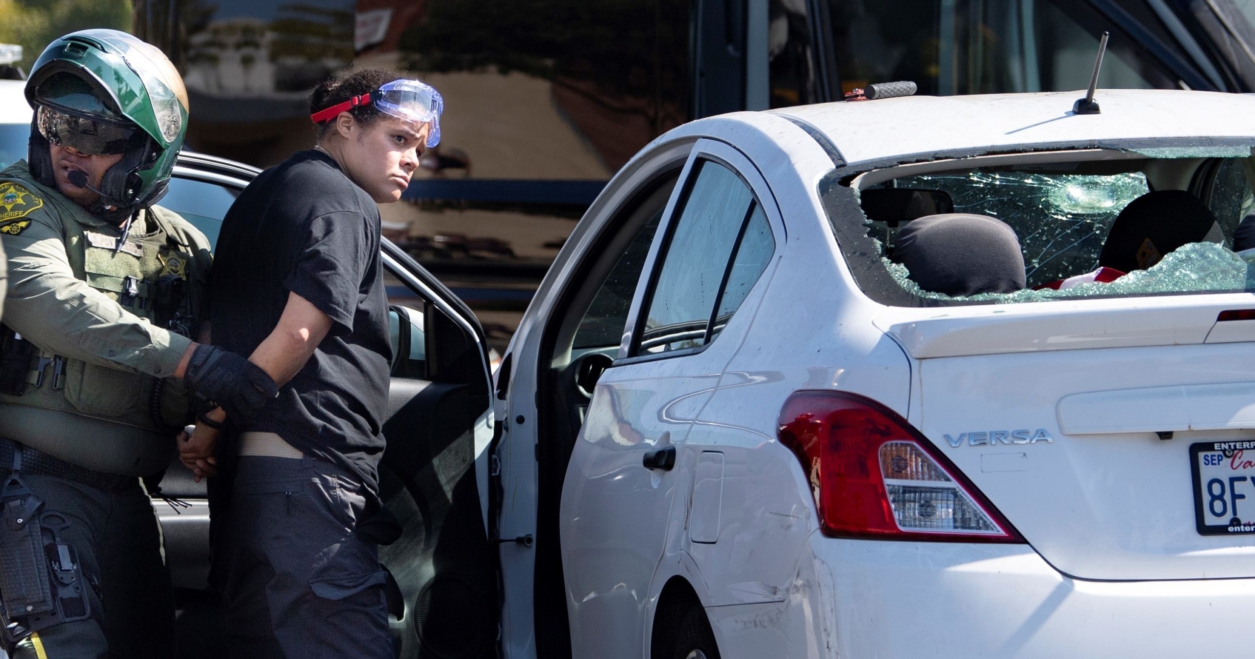 Tatiana Turner is taken into custody after witnesses said she drove her car into a crowd of protesters in Yorba Linda, California, on Sept. 26, 2020.