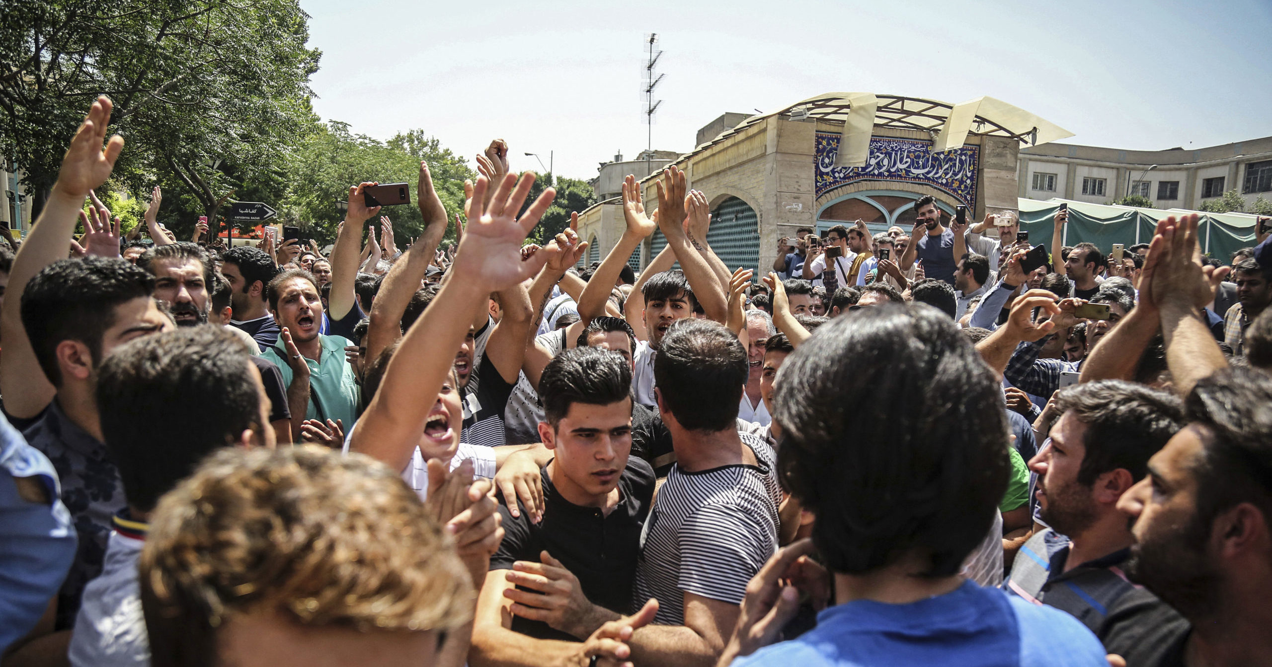 In this June 25, 2018, file photo, a group of protesters chant slogans in Tehran, Iran.