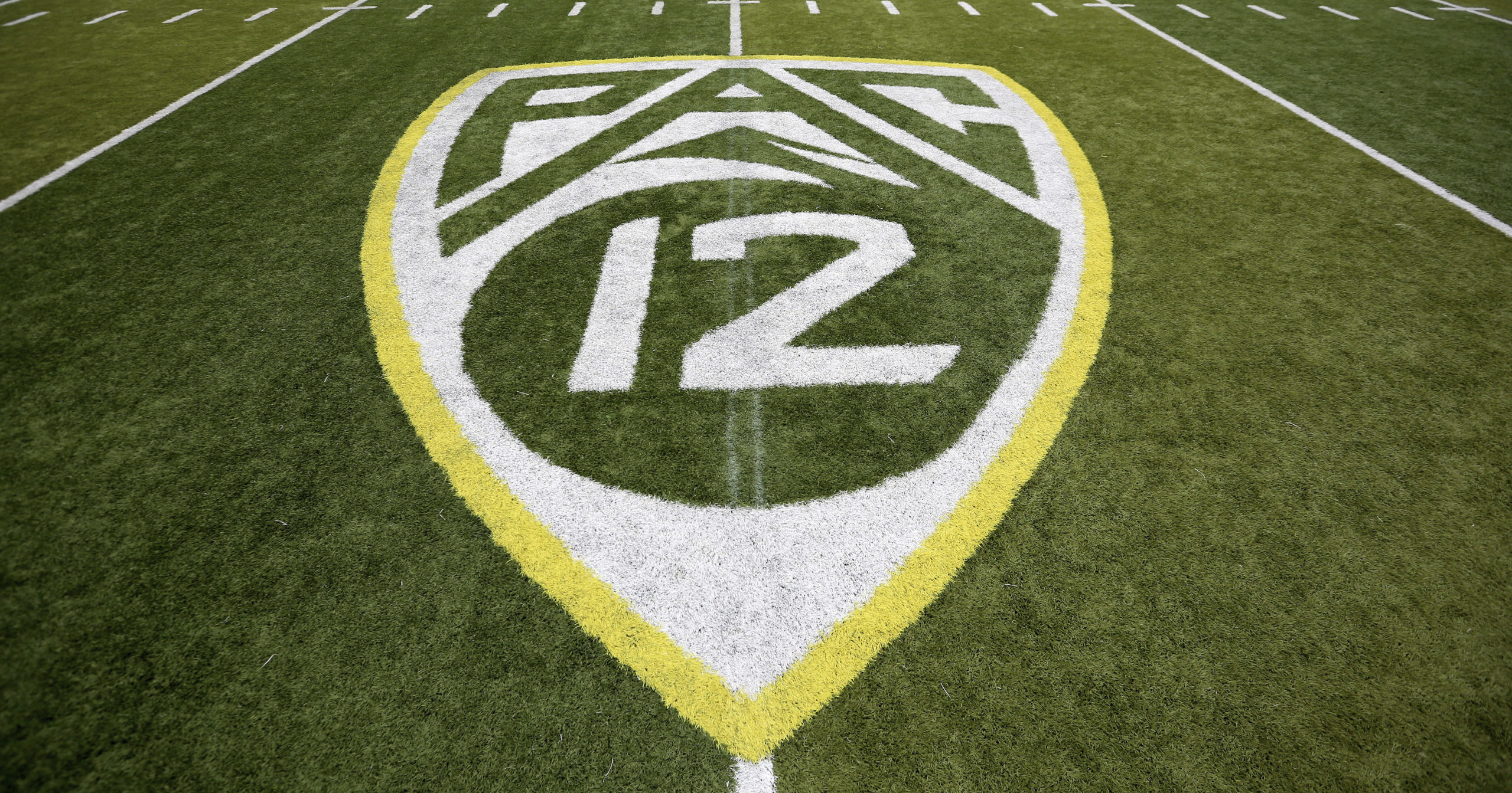In this Oct. 10, 2015, file photo, a Pac-12 logo is displayed on the field before an NCAA college football game between Washington State and Oregon in Eugene, Oregon.
