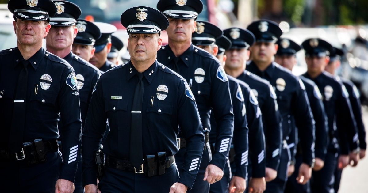 Santa Ana police officers leave a memorial service for a fellow officer on Nov. 15, 2018, in Westlake Village, California.