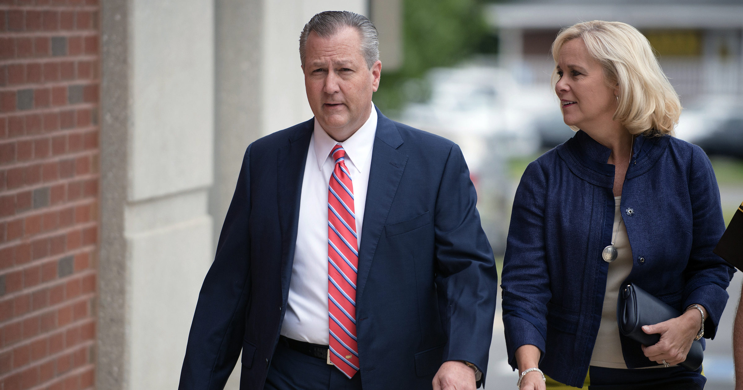 In this Sept. 2, 2016, file photo, Mike Hubbard, former Alabama Speaker of the House, and his wife, Susan, arrive for a hearing at the Lee County Justice Center in Opelika, Alabama. Mike Hubbard reported Sept. 11, 2020, to a county detention center to begin the sentence after an unsuccessful effort to overturn his ethics conviction.