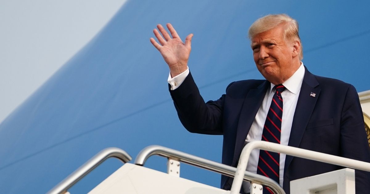 President Donald Trump waves as he steps off Air Force One upon arrival at Philadelphia International Airport in Philadelphia on Sept. 15, 2020.