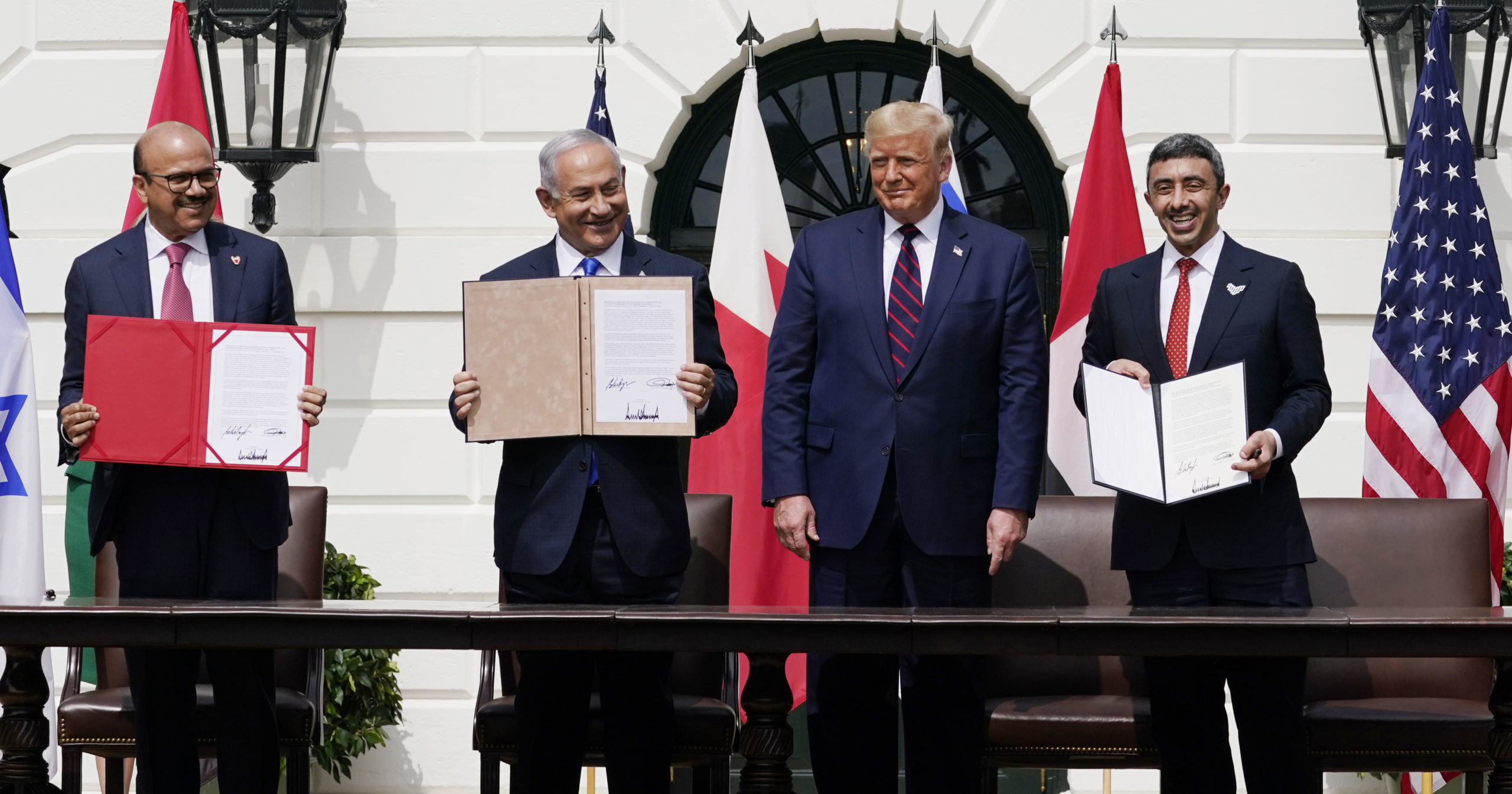 Bahrain Foreign Minister Khalid bin Ahmed Al Khalifa, Israeli Prime Minister Benjamin Netanyahu, US President Donald Trump and United Arab Emirates Foreign Minister Abdullah bin Zayed al-Nahyan attend the Abraham Accords signing ceremony on the South Lawn of the White House on Sept. 15, 2020, in Washington, D.C.