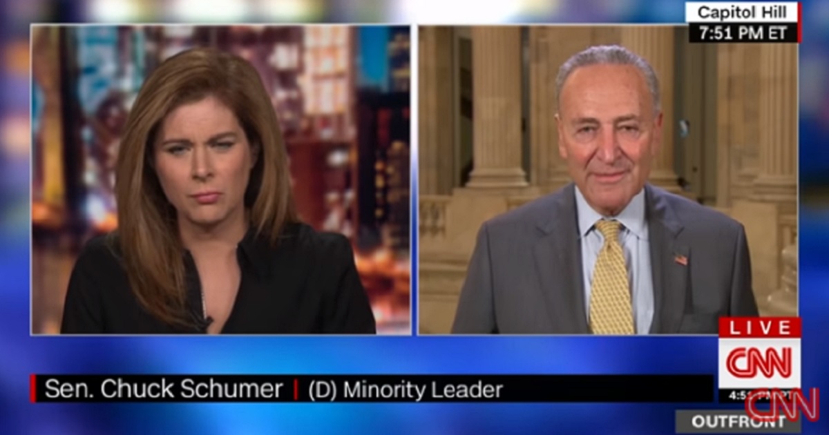 CNN host Erin Burnett, left, interivews Sen. Chuck Schumer, right.