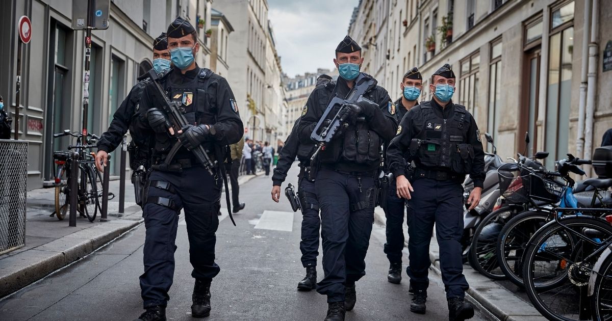 Police secure the area around the former Charlie Hebdo headquarters, the scene of a 2015 terrorist attack, after two people were stabbed on Sept. 25, 2020, in Paris.