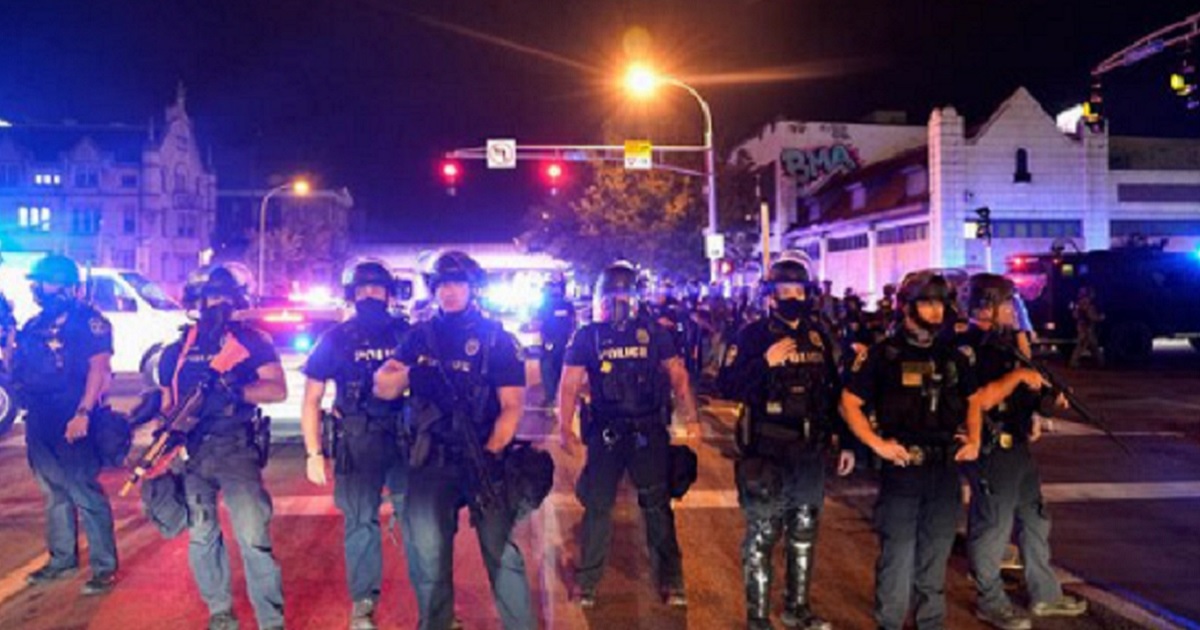 A line of Louisville police officers Wednesday night during rioting in the Kentucky city.