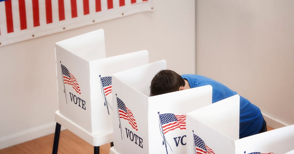 A man casts his vote in this stock image.