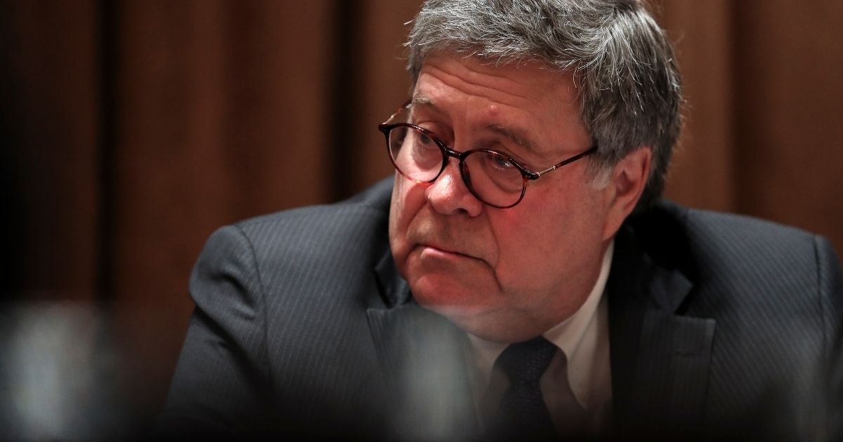 Attorney General William Barr listens during a discussion with state attorneys general in the White House on Sept. 23, 2020, in Washington, D.C.
