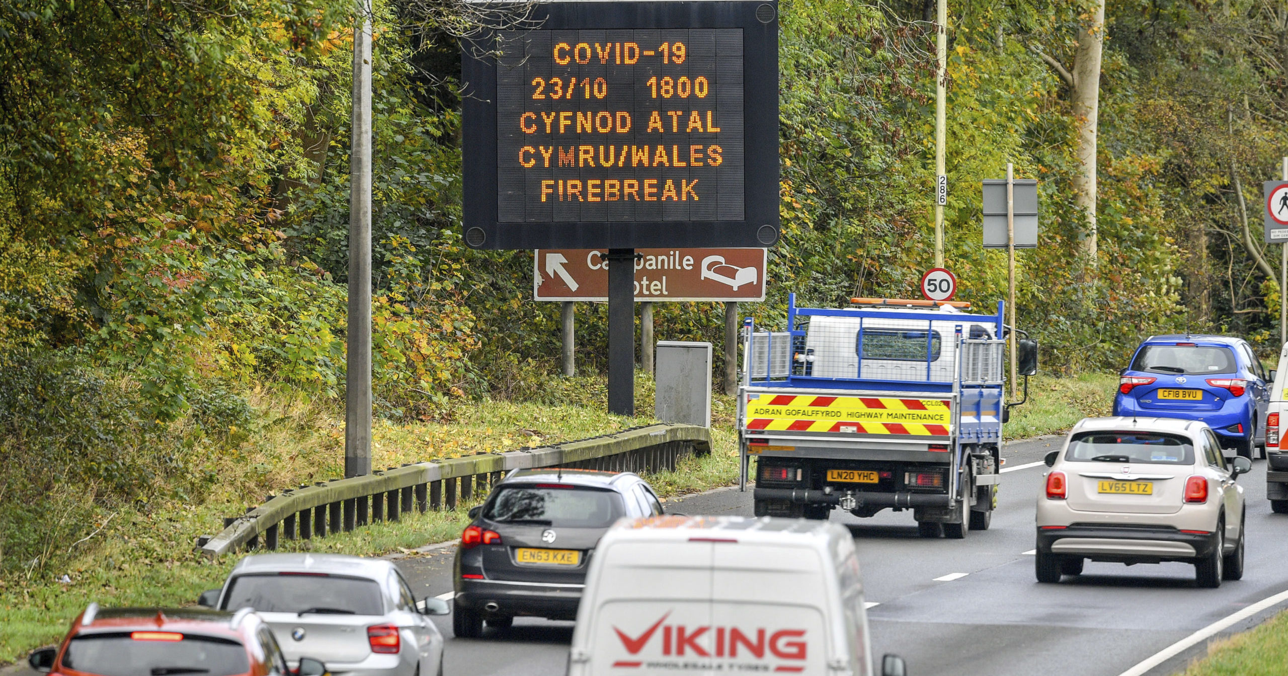 A sign is seen on a road into Wales on Oct. 23, 2020.