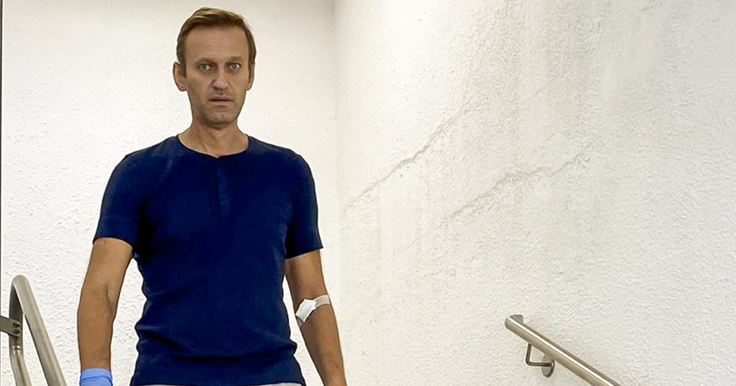 In this photo taken from a video published by Russian opposition leader Alexei Navalny on Instagram, Navalny walks down stairs in a hospital in Berlin on Sept. 19, 2020.