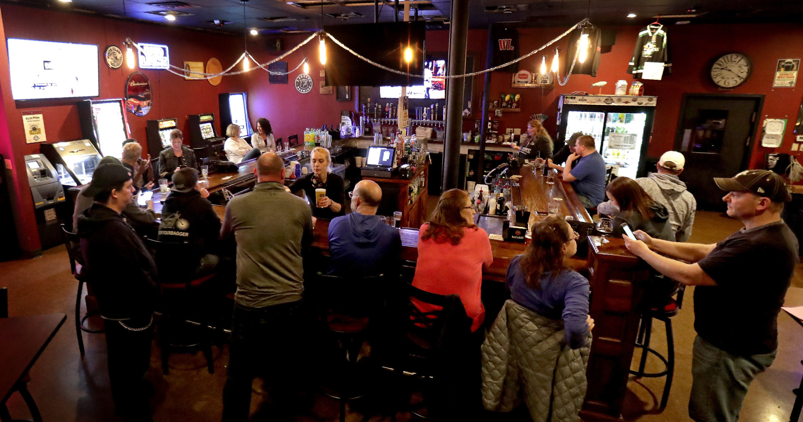 In this May 13, 2020, file photo, a pub opens to patrons in Appleton, Wisconsin. A Wisconsin judge on Oct. 14 temporarily blocked an order from Gov. Tony Evers' administration limiting the number of people who can gather in bars, restaurants and other indoor places.