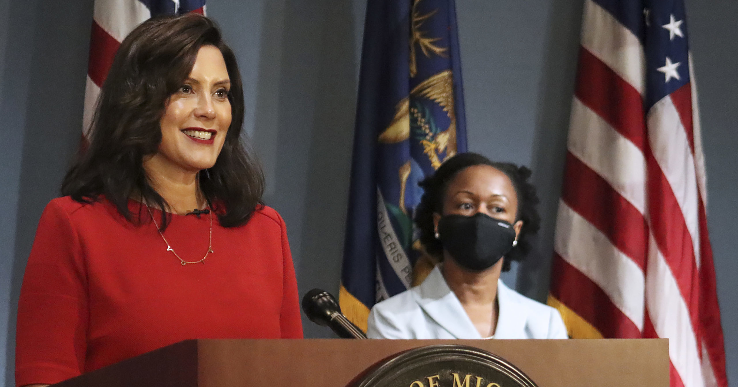 In this Sept. 16, 2020 file photo provided by the Michigan Office of the Governor, Gov. Whitmer addresses the state during a speech in Lansing, Michigan. According to a criminal complaint unsealed Oct. 8, six people plotted to kidnap Whitmer at her vacation home.