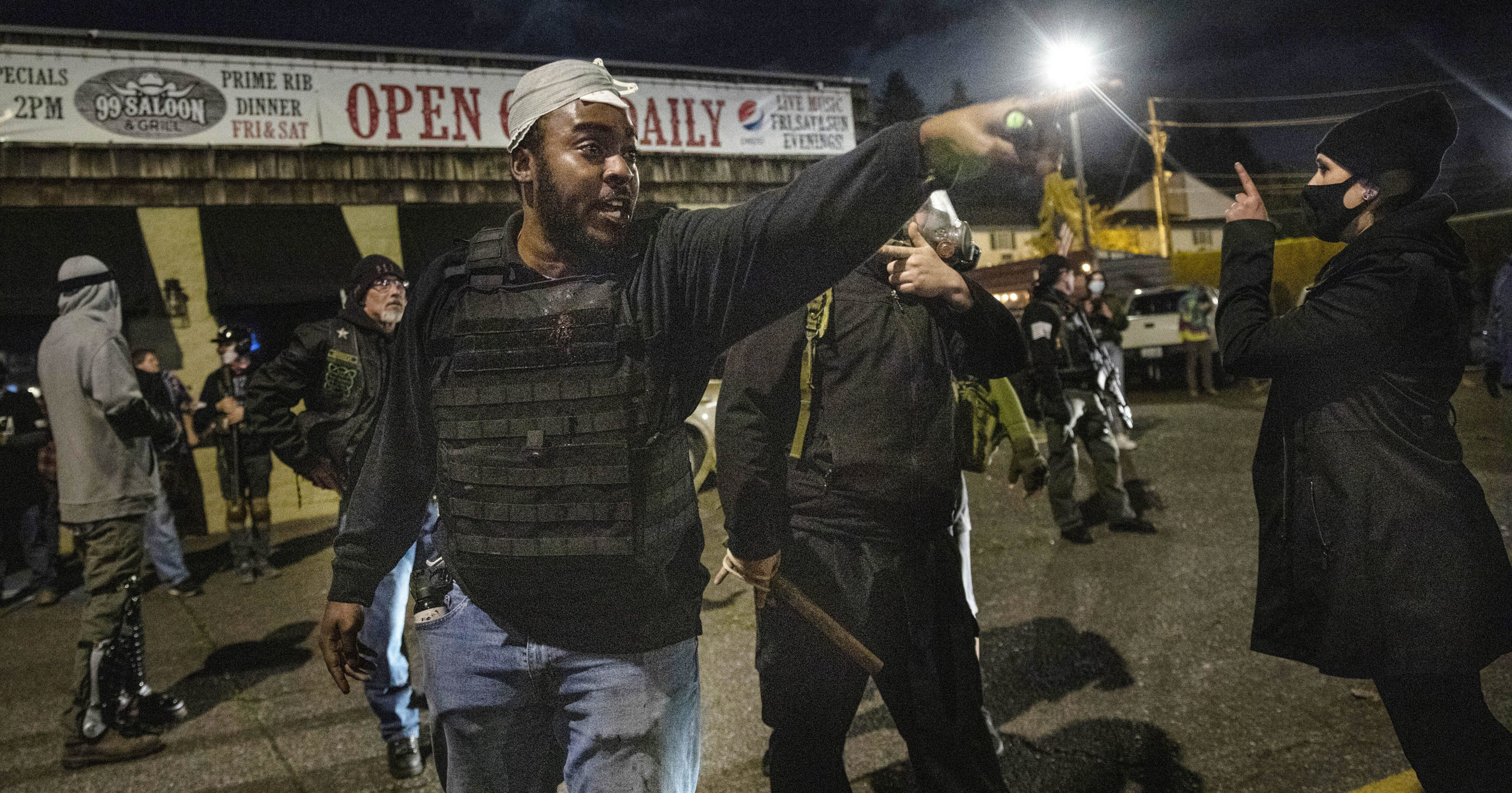 People gather during a protest in Vancouver, Washington, on Oct. 30, 2020, after a candlelight vigil for Kevin Peterson Jr.