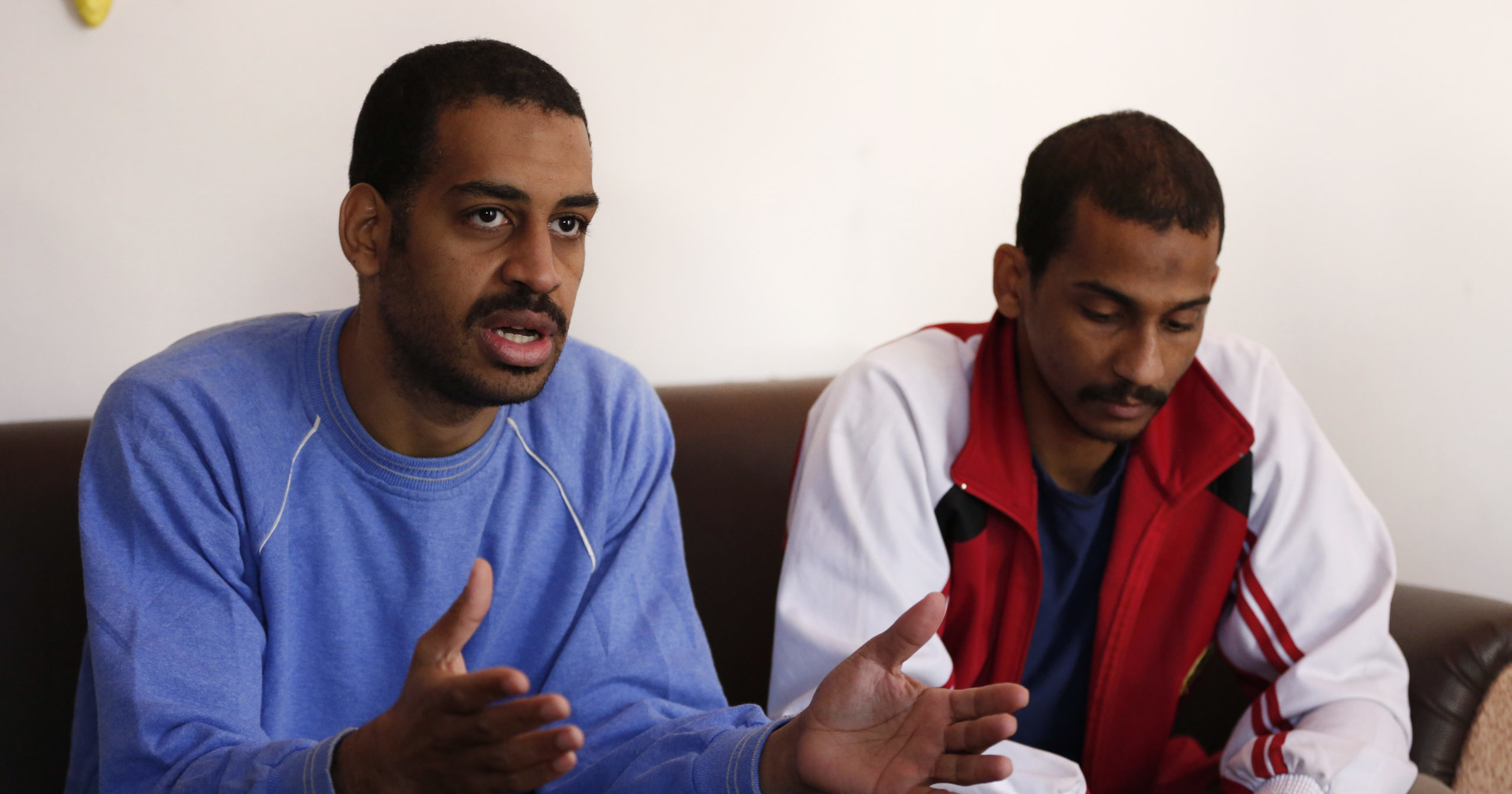 In this March 30, 2019, file photo, Alexanda Amon Kotey, left, and El Shafee Elsheikh speak during an interview with The Associated Press at a security center in Kobani, Syria.