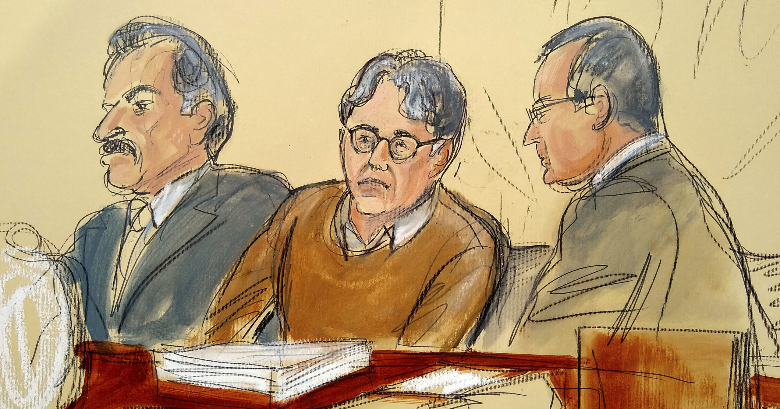 In this May 7, 2019, file courtroom drawing, defendant Keith Raniere, leader of the secretive group NXIVM, is seated between his attorneys during the first day of his sex trafficking trial.