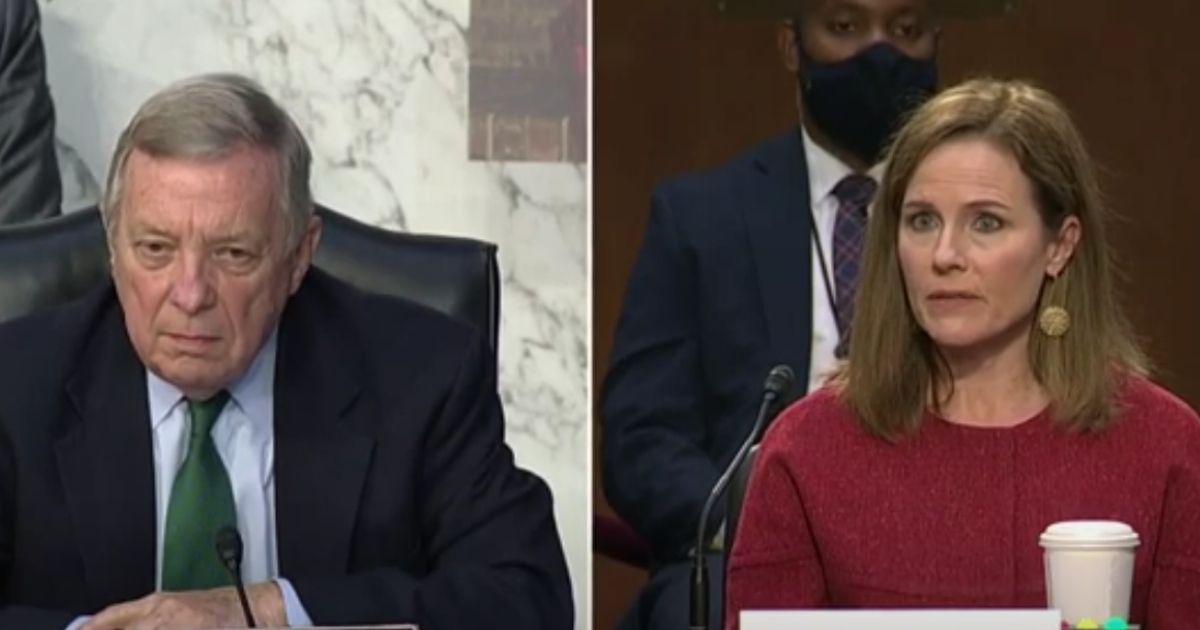 Amy Coney Barrett, right, and Democratic Sen. Dick Durbin of Illinois, left, during the second day of Barrett's hearing before the Senate Judiciary Committee regarding her nomination for Supreme Court justice.
