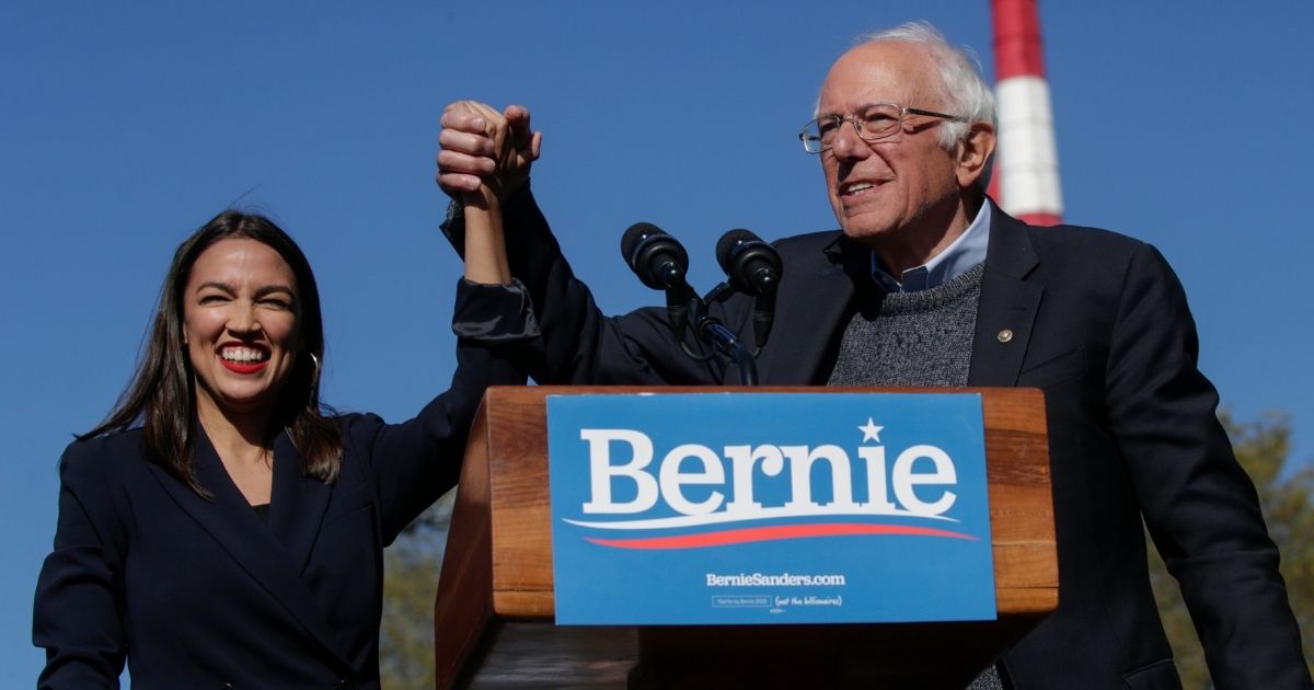 Democratic Rep. Alexandria Ocasio-Cortez of New York endorses independent Sen. Bernie Sanders of Vermont for president at a campaign rally in Queensbridge Park on Oct. 19, 2019, in the Queens borough of New York City.