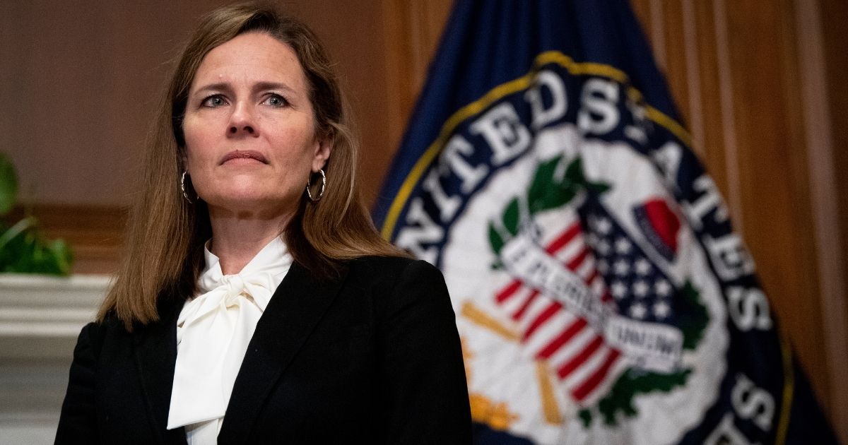 Judge Amy Coney Barrett, President Donald Trump's nominee to the Supreme Court, meets with Iowa GOP Sen. Joni Ernst (not seen) at the U.S. Capitol on Thursday in Washington, D.C.