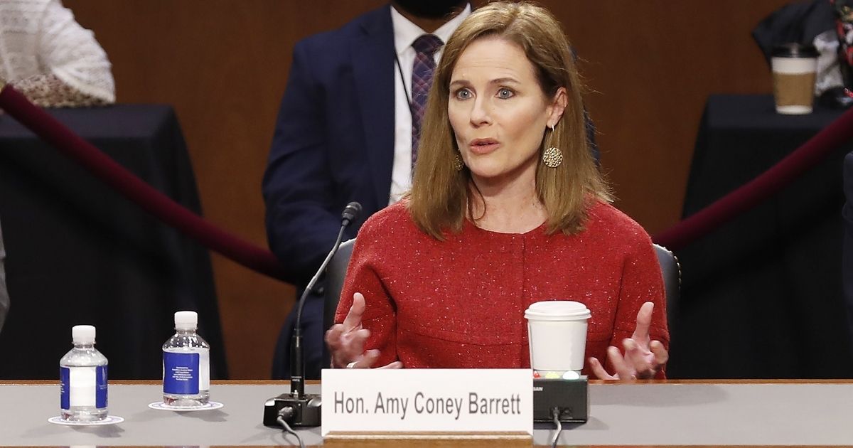 Supreme Court Justice nominee Judge Amy Coney Barrett responds to questions on the second day of her Supreme Court confirmation hearings Tuesday in Washington, D.C.