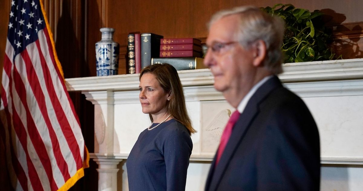 Seventh U.S. Circuit Court Judge Amy Coney Barrett, left, President Donald Trump's nominee for the Supreme Court, meets with Senate Majority Leader Mitch McConnell on Capitol Hill on Tuesday in Washington, D.C.