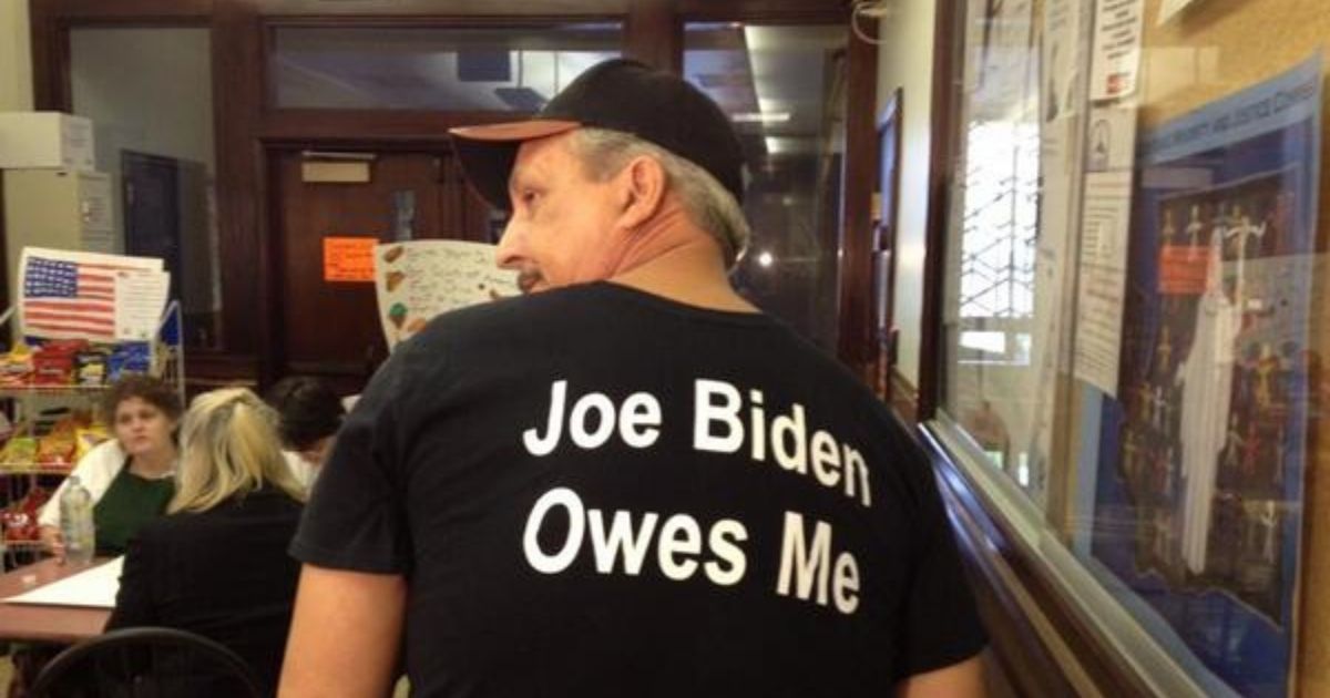 Jeffrey Barton of Vancouver, Washington, wears a shirt that says "Joe Biden Owes Me."