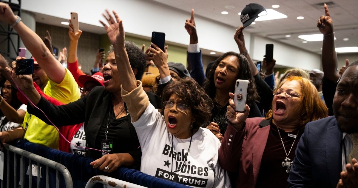 Supporters of President Donald Trump cheer as he arrives to speak during the launch of "Black Voices for Trump" at the Georgia World Congress Center on Nov. 8, 2019, in Atlanta.