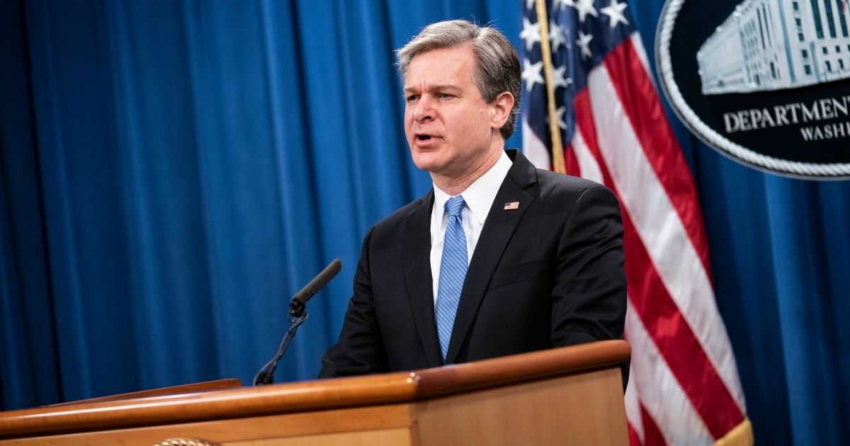 FBI Director Christopher Wray speaks during a virtual news conference at the Department of Justice Wednesday in Washington.