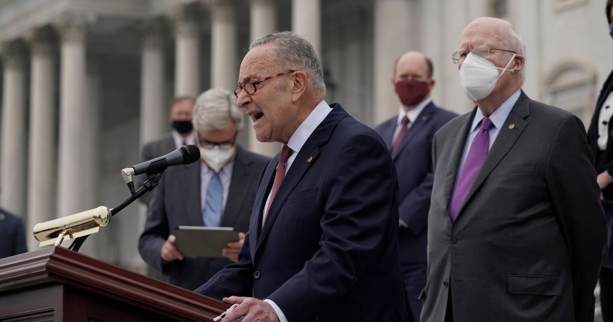 Senate Minority Leader Chuck Schumer of New York and Democratic members of the Senate Judiciary Committee hold a news conference after boycotting the vote by the Republican-led panel to advance the nomination of Judge Amy Coney Barrett to sit on the Supreme Court on Thursday in Washington.