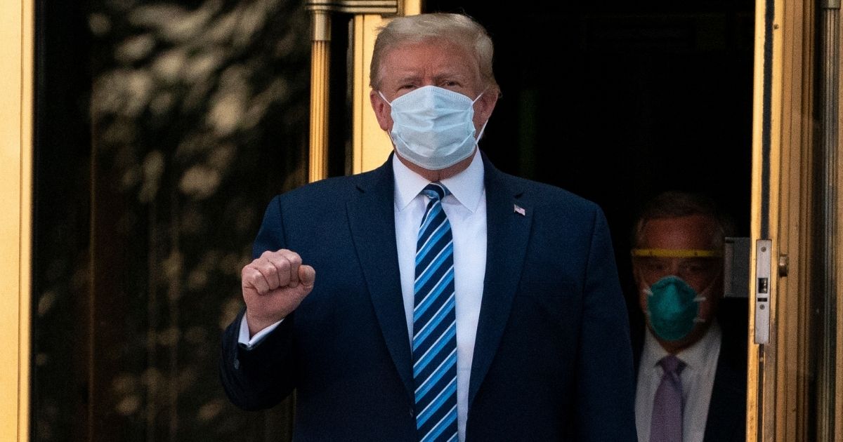 President Donald Trump walks out of Walter Reed National Military Medical Center in Bethesda, Maryland, on Oct. 5, 2020, after receiving treatment as a COVID-19 patient.
