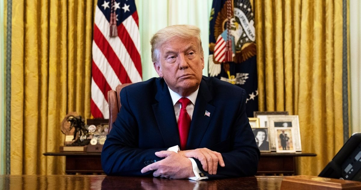 President Donald Trump listens during an event in the Oval Office of the White House on Aug. 28, 2020, in Washington, D.C.