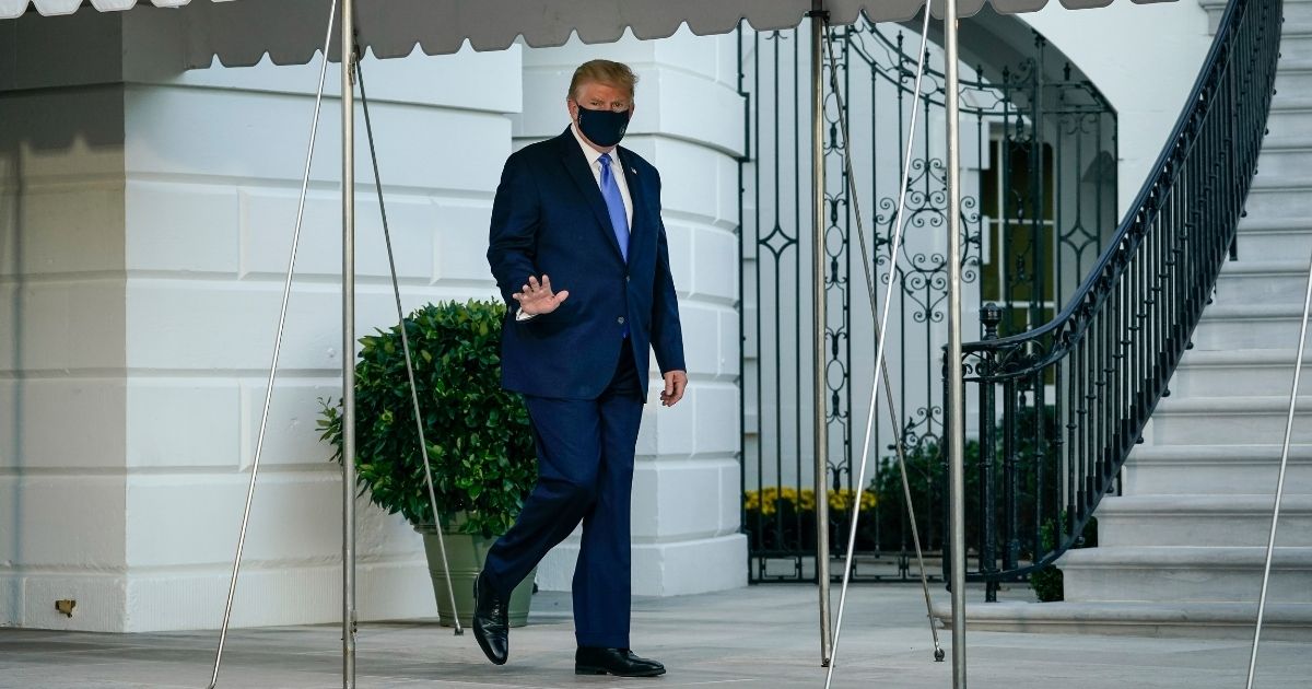 President Donald Trump leaves the White House for Walter Reed National Military Medical Center on the South Lawn of the White House on Friday in Washington, D.C.