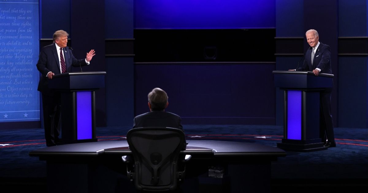 President Donald Trump, left, and Democratic presidential nominee Joe Biden, right, participate in the first presidential debate moderated by Fox News anchor Chris Wallace, center, at the Health Education Campus of Case Western Reserve University on Tuesday in Cleveland, Ohio.