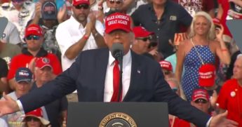 Woman rips things up at Trump rally.