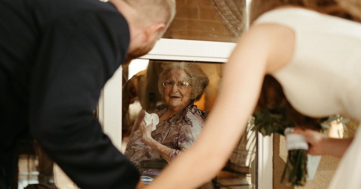 Clay and Megan Moore visit their grandma at the nursing home on their wedding day.