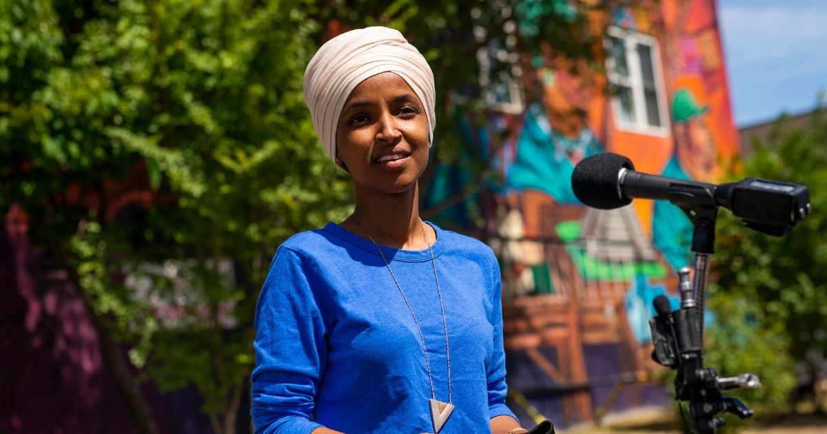 Minnesota Democratic Rep. Ilhan Omar speaks with media gathered outside Mercado Central on Aug. 11, 2020, in Minneapolis, Minnesota.