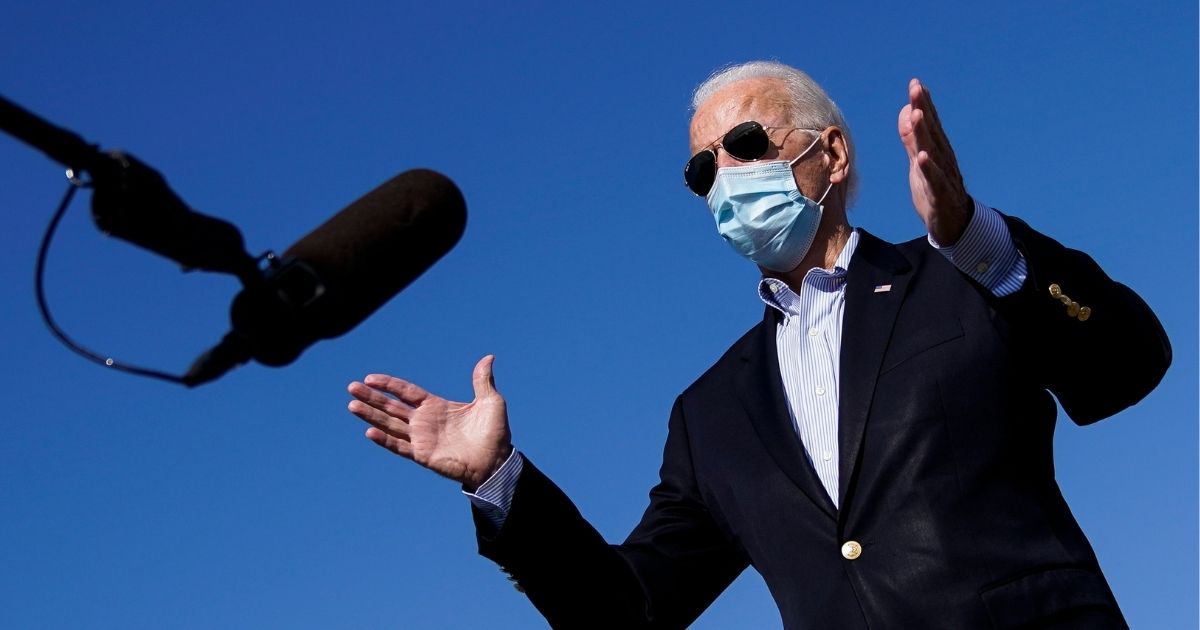 Democratic presidential nominee Joe Biden speaks to reporters before boarding his campaign plane at New Castle Airport in New Castle, Delaware, on Thursday.