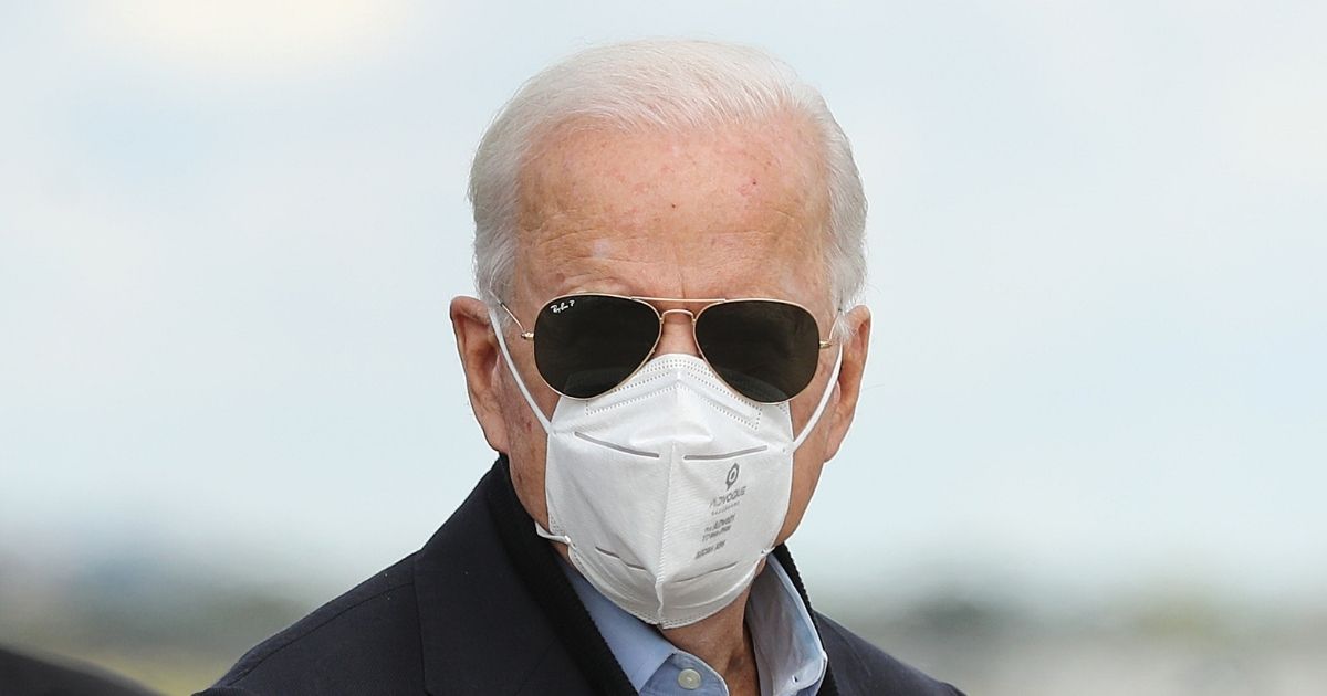 Democratic presidential nominee Joe Biden waves before traveling to Grand Rapids, Michigan, at New Castle County Airport in New Castle, Delaware, on Friday.