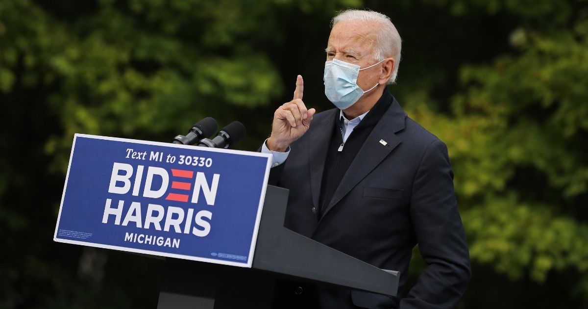 Democratic presidential nominee Joe Biden delivers remarks in the parking lot of the United Food and Commercial Workers International Union Local 951 while campaigning Friday in Grand Rapids, Michigan.