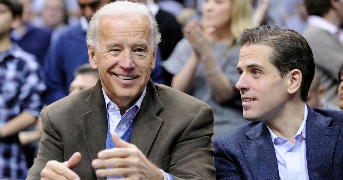 In this Jan. 30, 2010, file photo, then-Vice President Joe Biden, left, is seen with his son Hunter at the Duke-Georgetown NCAA college basketball game in Washington.