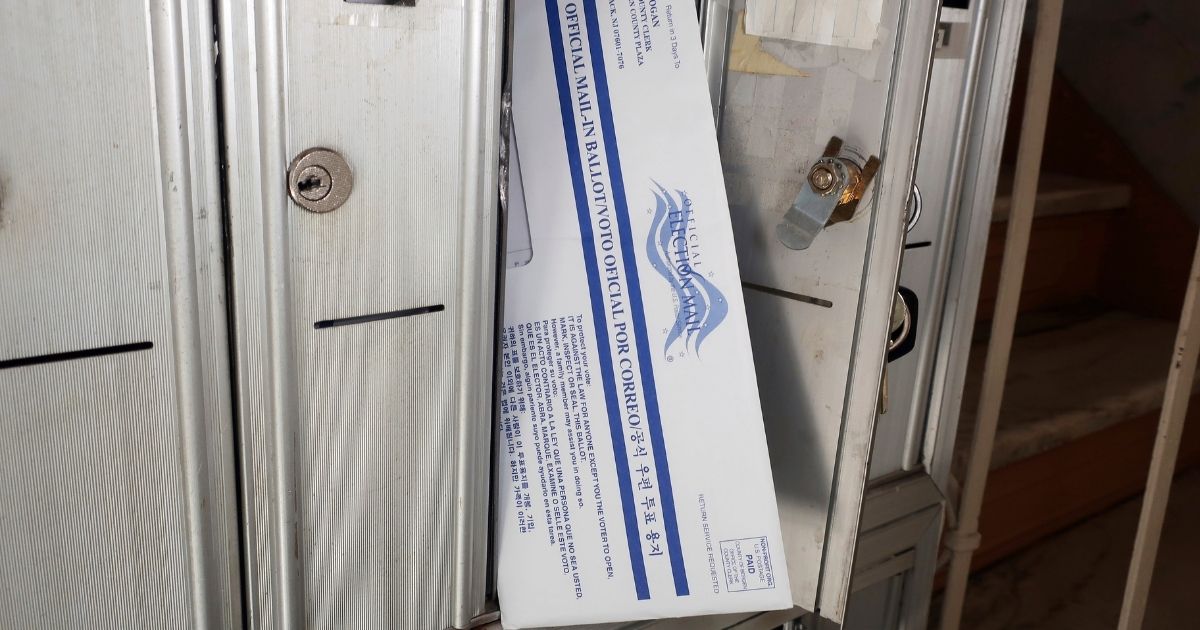 A mail-in ballot for the presidential election is positioned in the mailbox where it arrived in Rutherford, New Jersey, on Friday.